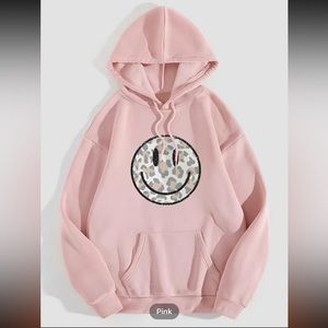PINK CAMO SMILE HAPPY HOODIE. Pretty true to size, would order 1 size bigger.